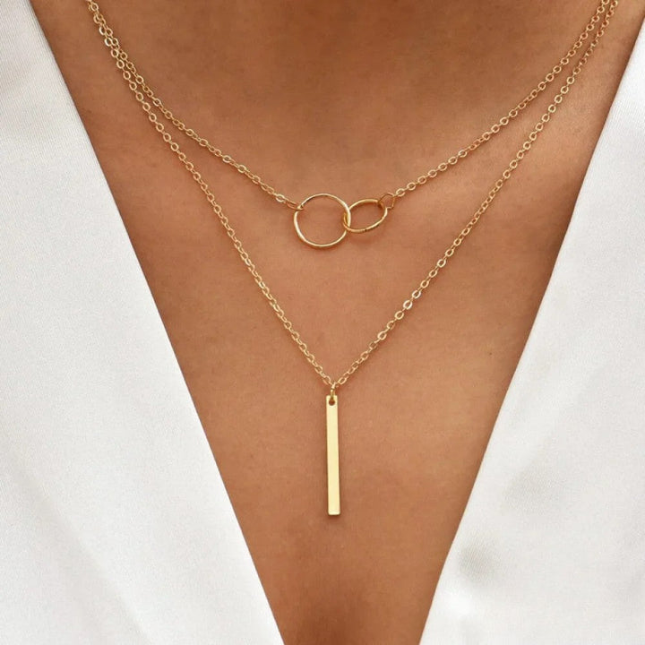Nina | Collana rétro dorata con ciondolo a doppio cerchio