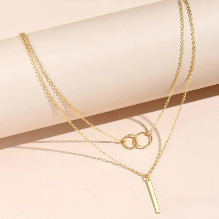 Nina | Collana rétro dorata con ciondolo a doppio cerchio
